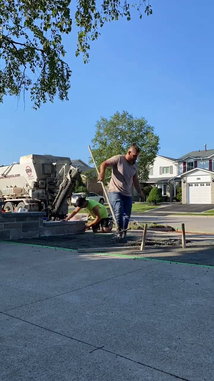 Concrete truck pouring a driveway repair